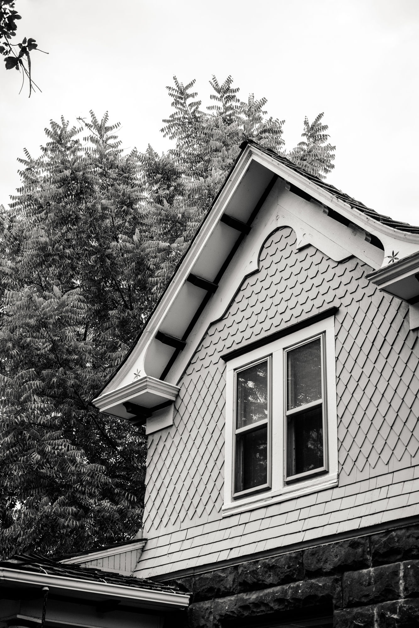 Detail of a craftsman-style home's gabled roofline in Austin, Texas