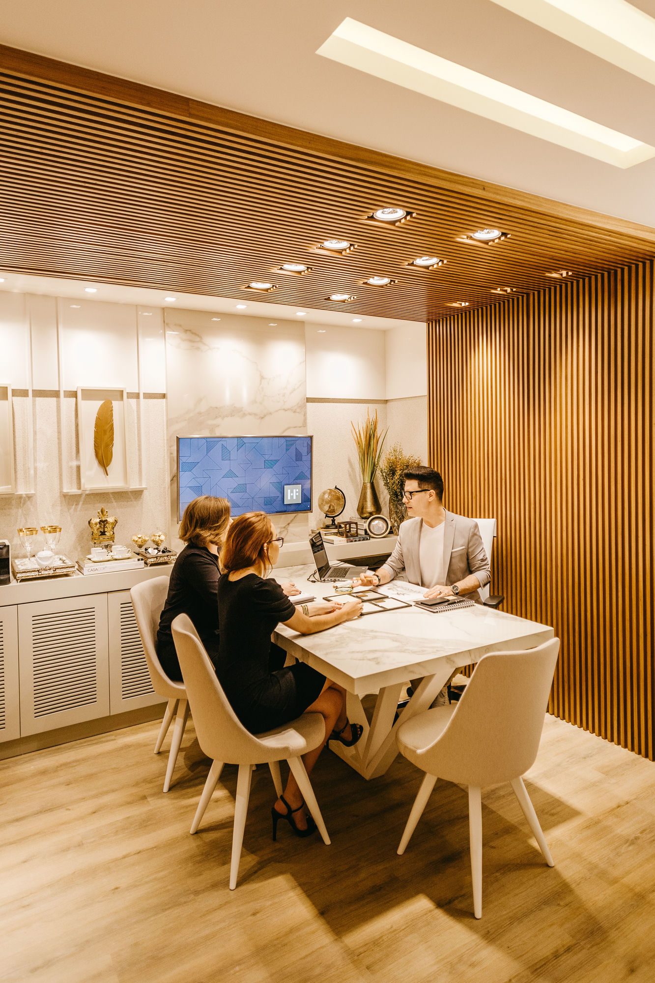 Property manager meeting with clients at the office